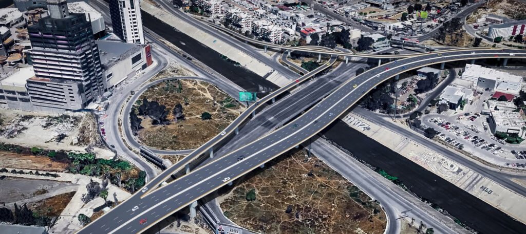 Vista aérea de los distribuidores viales y el libramiento entre Otay I y Otay II en Tijuana para transporte de carga.